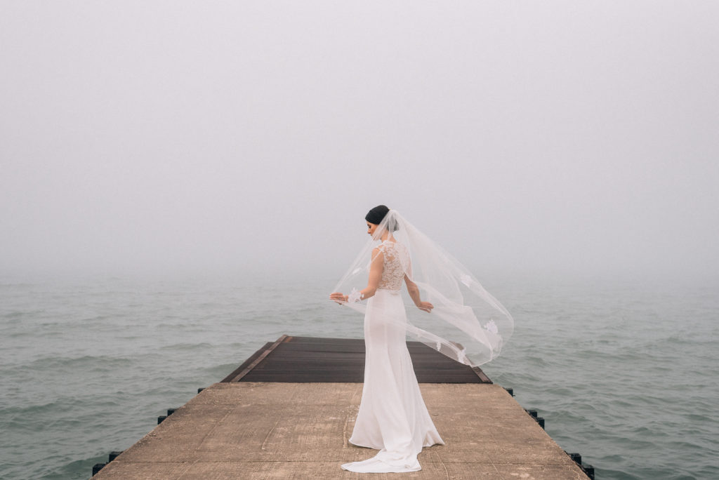 Bride on pier at Elder Lane Beach in Winnetka IL